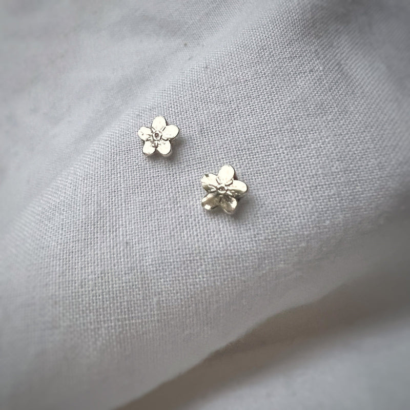 Silver Leaves Tiny Forget Me Not Stud Earrings on White Background