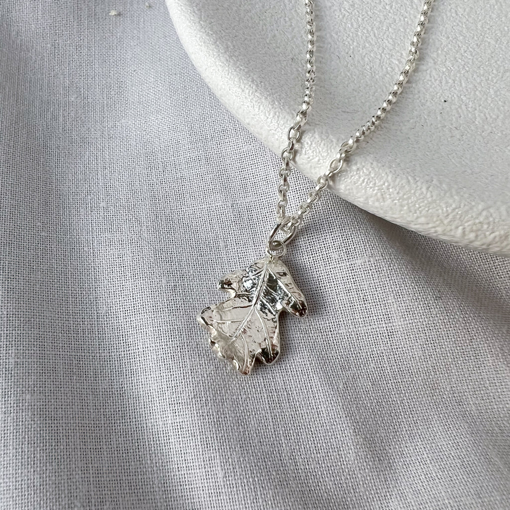 Silver Oak Leaf necklace on white background