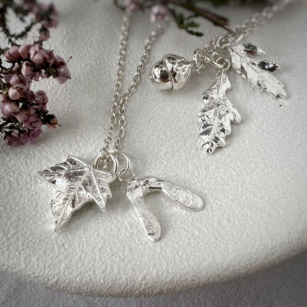 Silver Nature Charm Necklaces on White Background
