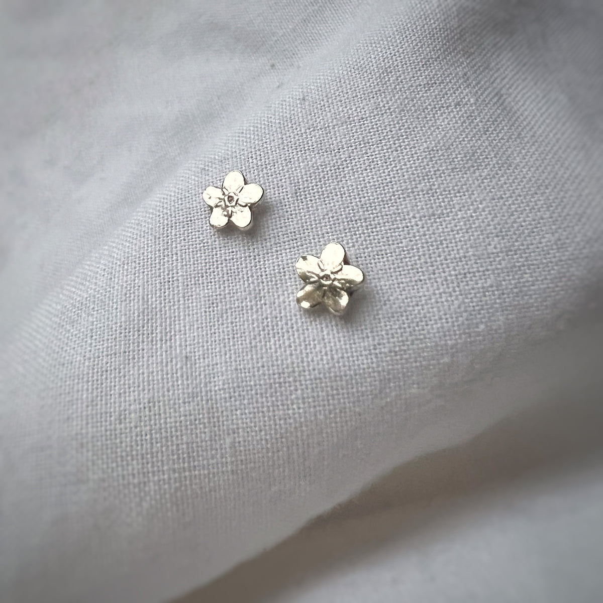 Silver Leaves Tiny Forget Me Not Stud Earrings on White Background