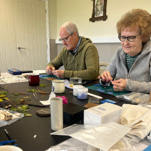 Lady and man participating in craft workshop