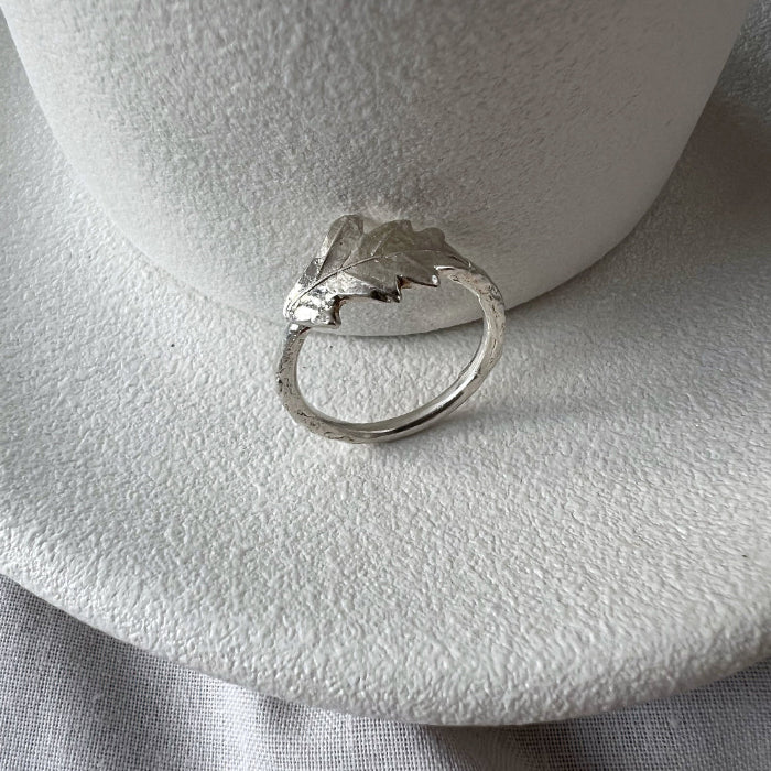 Silver Oak Leaf Ring on White Plate