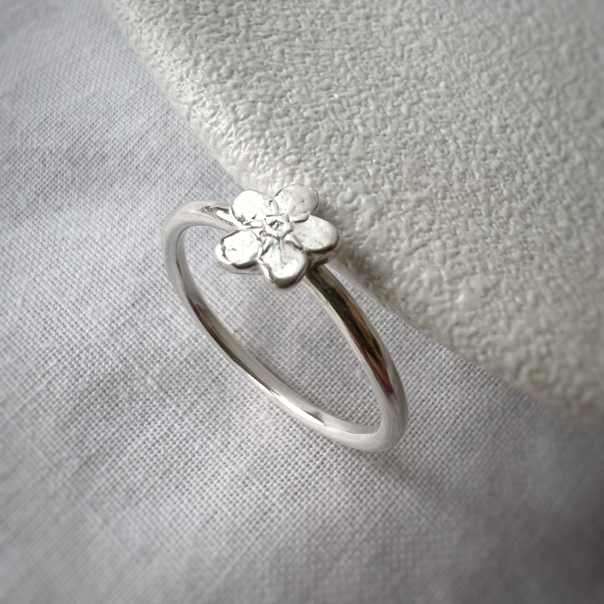 Single Silver Forget Me Not on Silver Band with White Background